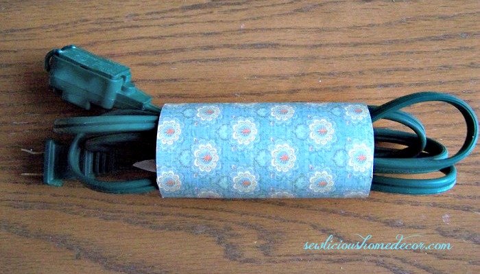 Decorated toilet paper cord organizer
