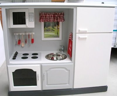 Recycled entertainment center play kitchen with stove top and refrigerator 